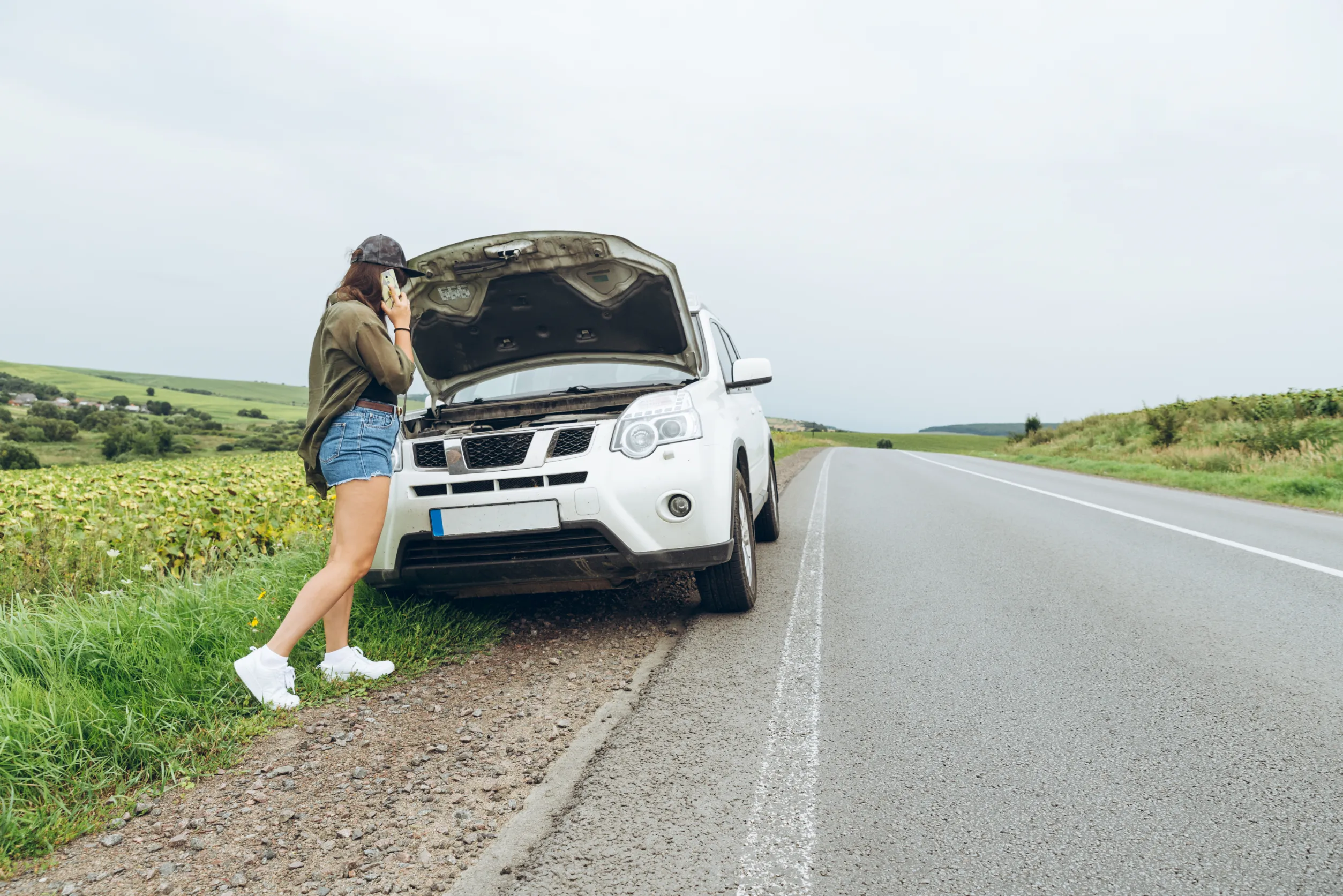 Woman calling emergency fuel recovery in Sydney after car damaged by wrong fuel, 24/7 service Woman calling emergency fuel recovery in Sydney after car damaged by wrong fuel, 24/7 service