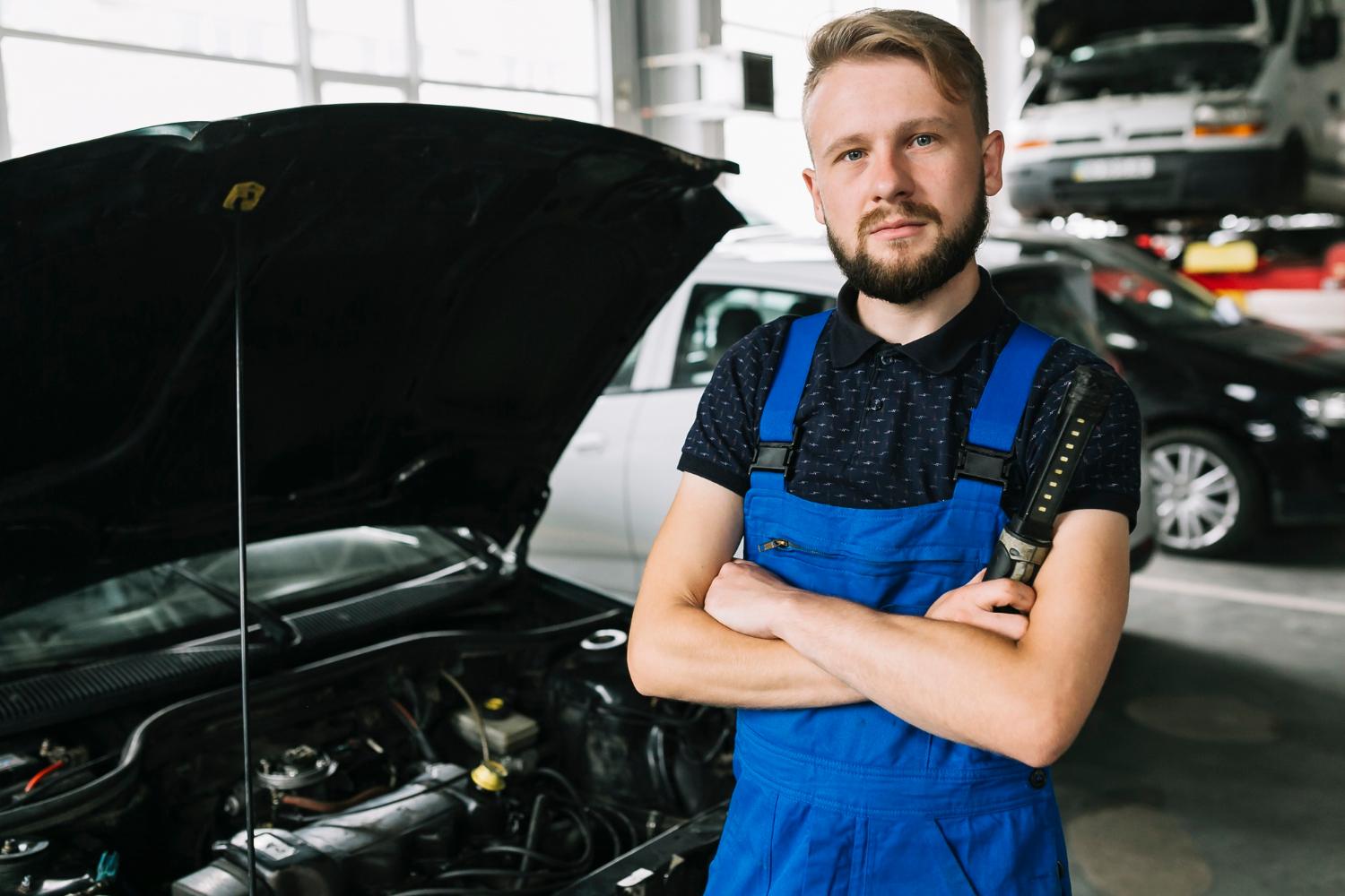 Happy mechanic after successfully fixing car affected by wrong fuel, emergency fuel recovery Sydney Happy mechanic after successfully fixing car affected by wrong fuel, emergency fuel recovery Sydney