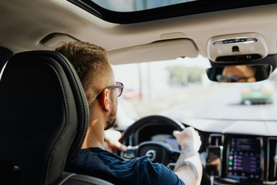 A man driving a car.